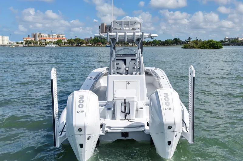 Slide: The Image of 2024 Costa Custom Boats 264HC with dual Mercury 300 V8 engines on the water. - 7