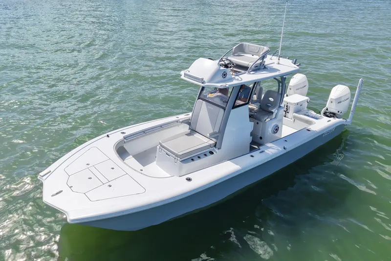 Slide: The Image of 2024 Costa Custom Boats 264HC on water, showcasing sleek design and dual engines. - 9