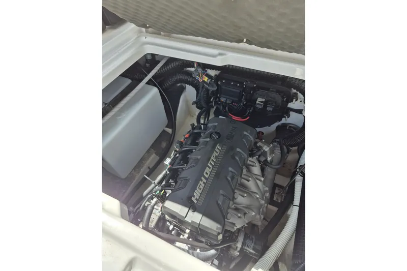 Slide: The Image of Engine compartment of 2021 Yamaha Boats 252SE, showcasing high output engine components. - 14