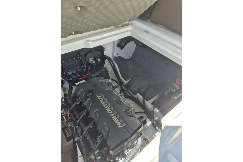 Slide: The Image of 2021 Yamaha Boats 252SE engine compartment showcasing high output engine components. - 15