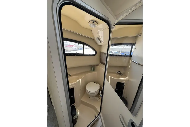 Slide: The Image of Interior view of 2003 Grady-White Sailfish 282 boat bathroom with toilet and sink. - 20