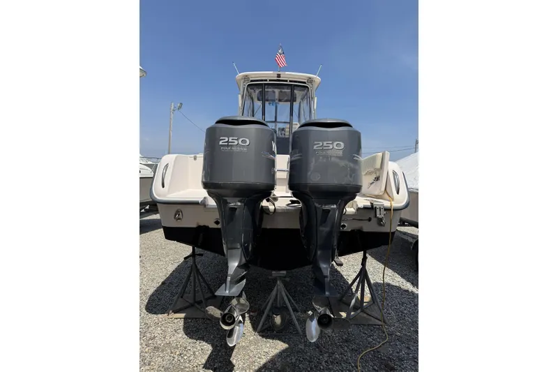 Slide: The Image of 2003 Grady-White Sailfish 282 boat with twin 250 horsepower outboard engines. - 21