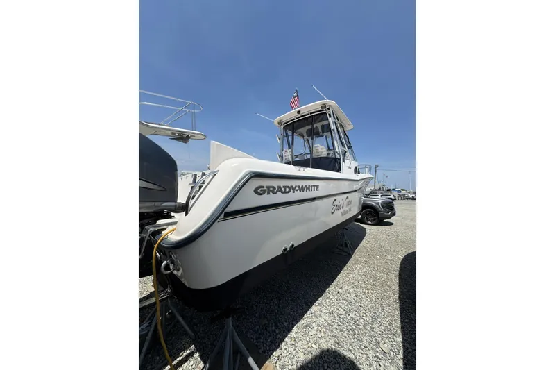 Slide: The Image of 2003 Grady-White Sailfish 282 boat on display under clear blue sky. - 4