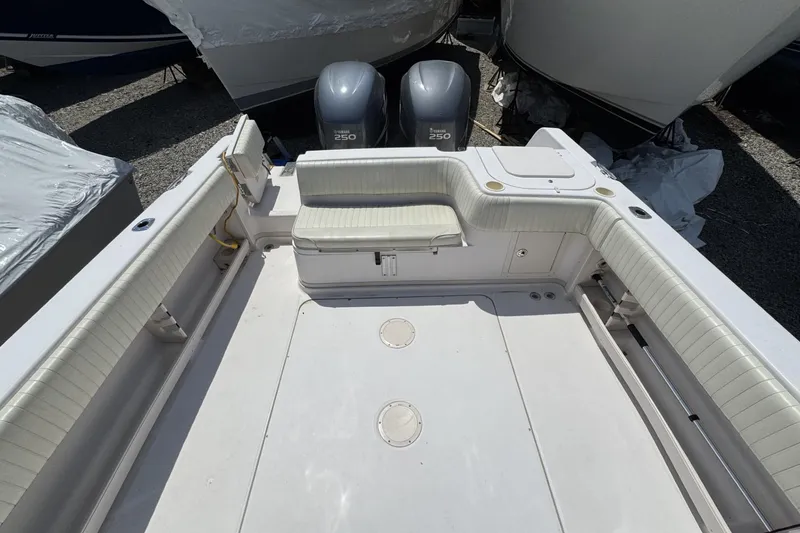 Slide: The Image of 2003 Grady-White Sailfish 282 boat interior with seating and twin Yamaha 250 engines. - 5