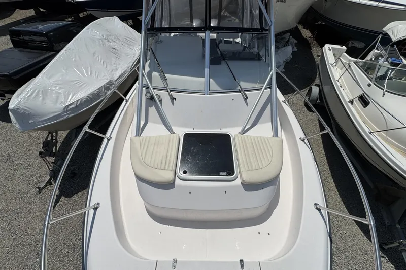 Slide: The Image of 2003 Grady-White Sailfish 282 boat, top view, docked among other boats. - 8