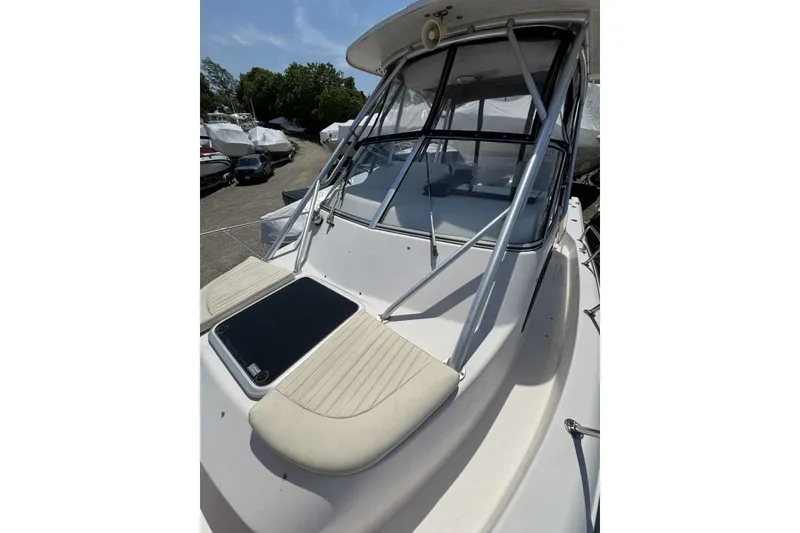 Slide: The Image of 2003 Grady-White Sailfish 282 boat deck with seating and windshield. - 9