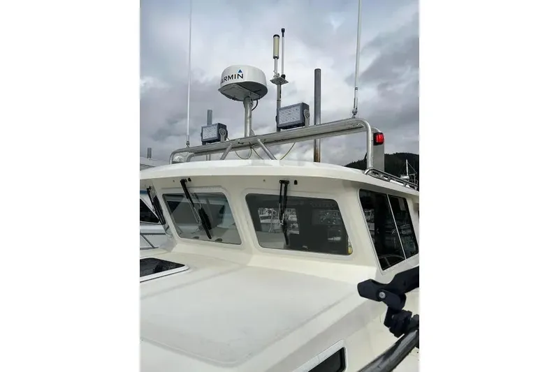 Slide: The Image of 2001 SeaSport Pacific 3200 boat with radar and antennas on deck. - 19