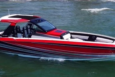 Slide: The Image of 2021 Cigarette 41' Nighthawk boat in vibrant red on open water. - 5