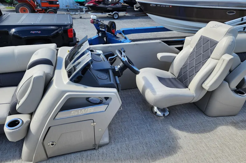 Slide: The Image of 2022 Silver Wave 2410 SW5 boat interior with luxurious seating and modern dashboard. - 11