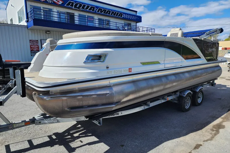 Slide: The Image of 2022 Silver Wave 2410 SW5 pontoon boat on trailer at Aqua-Mania dealership. - 3