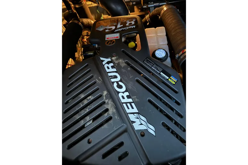 Slide: The Image of Engine of a 2003 Sea Ray 340 Sundancer with Mercury branding visible. - 17