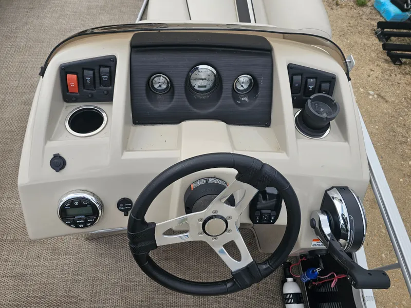 Slide: The Image of Dashboard of a 2020 Bennington 20SV boat with steering wheel and instruments. - 10