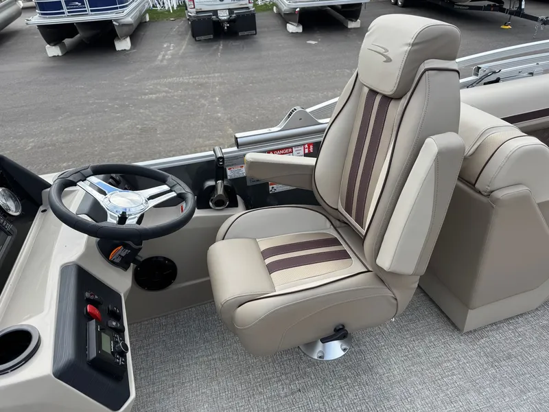 Slide: The Image of Interior of 2026 Bennington 22SSR-SPS (PB) with steering wheel and seat. - 14