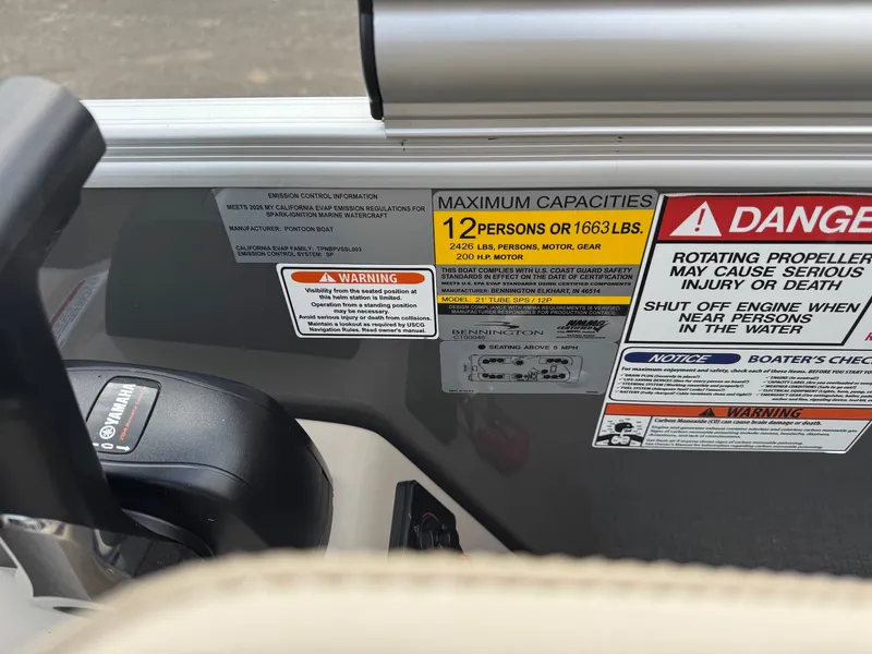 Slide: The Image of Warning labels and capacity details on a Bennington 22SSR-SPS (PB) boat. - 19