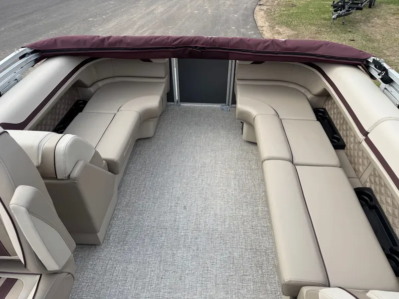 Slide: The Image of Interior of 2026 Bennington 22SSR-SPS (PB) with beige leather seating. - 22