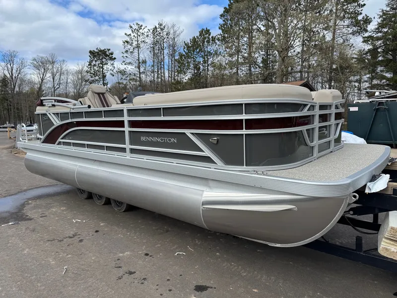 Slide: The Image of 2026 Bennington 22SSR-SPS pontoon boat parked outdoors. - 4