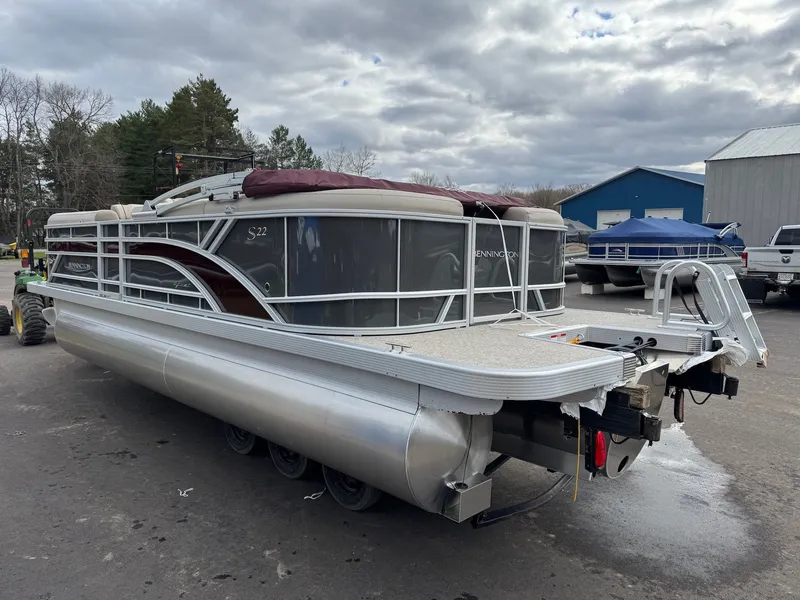 Slide: The Image of 2026 Bennington 22SSR-SPS pontoon boat parked outdoors. - 5