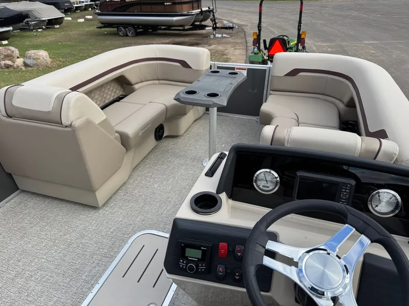 Slide: The Image of Interior of a 2026 Bennington 22SSR-SPS pontoon boat with luxurious seating. - 9
