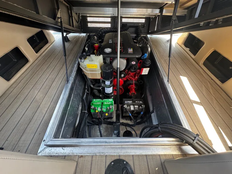 Slide: The Image of Engine compartment of a 2017 Bennington 25QXCWIO boat with open deck. - 15
