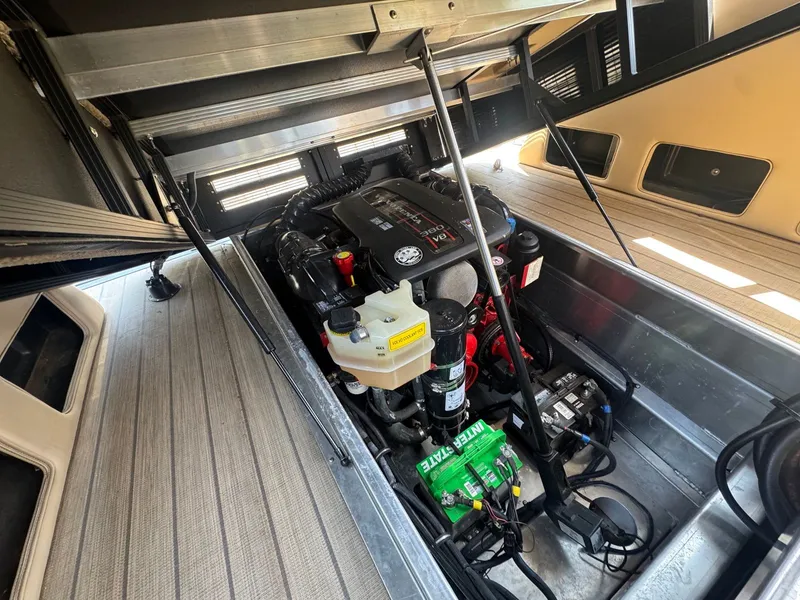 Slide: The Image of Engine compartment of a 2017 Bennington 25QXCWIO boat with Mercury engine. - 16