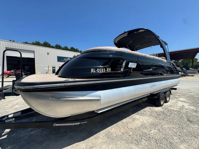 Slide: The Image of 2017 Bennington 25QXCWIO pontoon boat on trailer. - 4