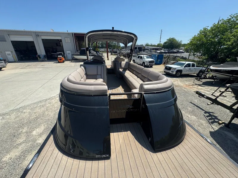 Slide: The Image of 2017 Bennington 25QXCWIO pontoon boat parked outdoors. - 8