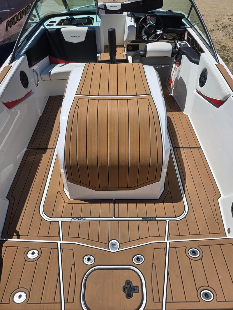 Slide: The Image of Interior of a 2019 Nautique 200 boat with wood finish. - 10