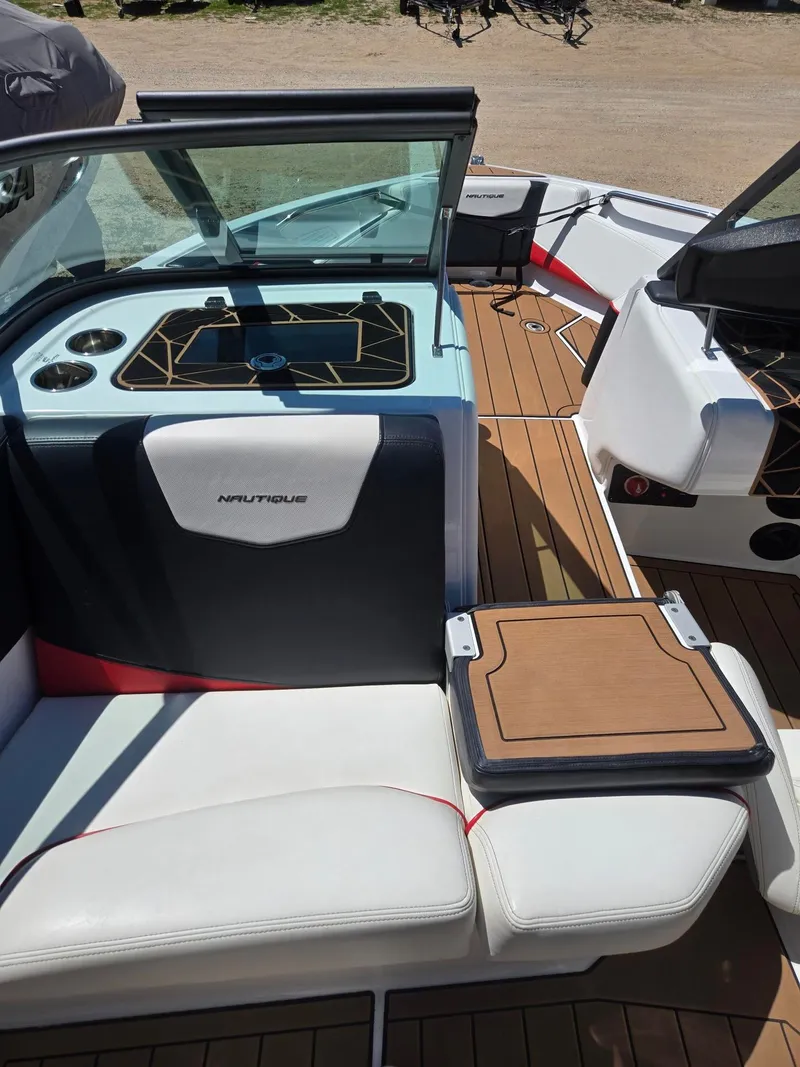 Slide: The Image of Interior of a 2019 Nautique 200 boat with luxurious features. - 13
