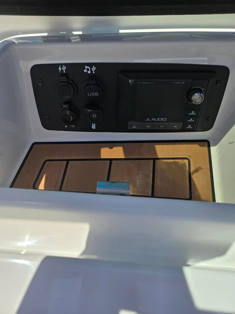 Slide: The Image of Nautique 200 2019 boat console with JL Audio system and USB port. - 14