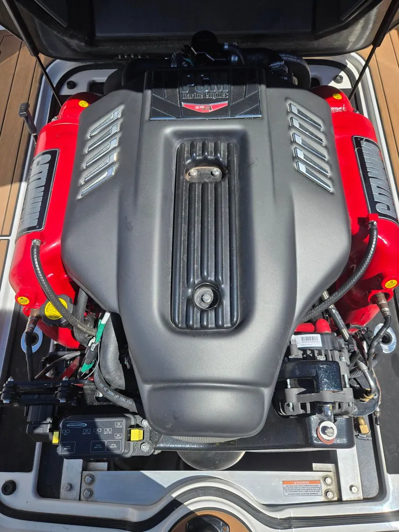 Slide: The Image of Engine of a 2019 Nautique 200 boat, close-up view. - 16