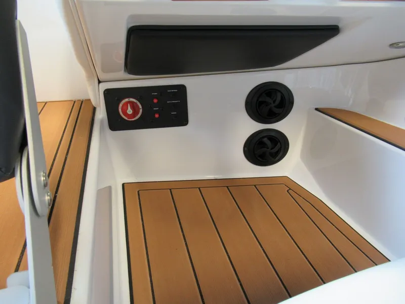 Slide: The Image of Interior of a 2019 Nautique 200 boat with wood flooring. - 20