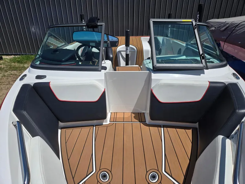 Slide: The Image of Interior of a 2019 Nautique 200 boat with wooden flooring. - 6
