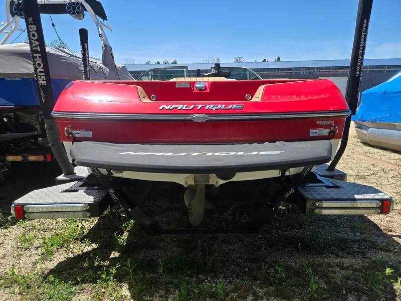 Slide: The Image of Red 2019 Nautique 200 boat, rear view on a trailer. - 7