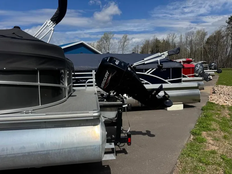 Slide: The Image of 2021 SunCatcher Vista 16 pontoon boat parked outdoors. - 3
