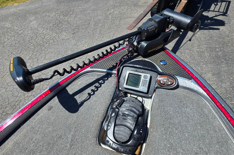 Slide: The Image of 2011 Triton 20XS DC boat dashboard with trolling motor and navigation system. - 10