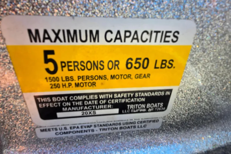 Slide: The Image of 2011 Triton 20XS DC boat capacity label: 5 persons or 650 lbs, 250 HP motor. - 15
