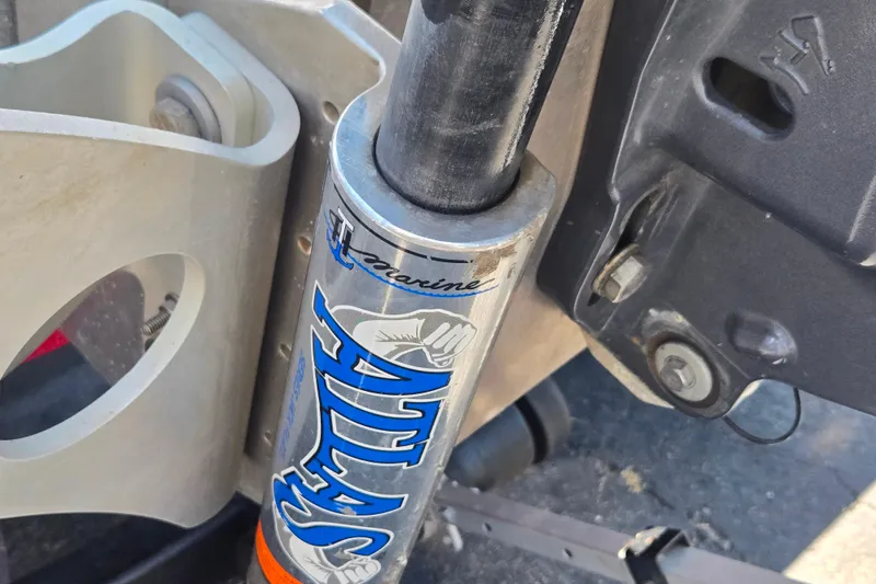 Slide: The Image of Close-up of a 2011 Triton 20XS DC boat's Atlas hydraulic jack plate. - 16