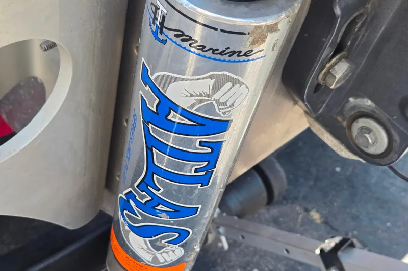 Slide: The Image of Close-up of Atlas hydraulic jack plate on a 2011 Triton 20XS DC boat. - 17
