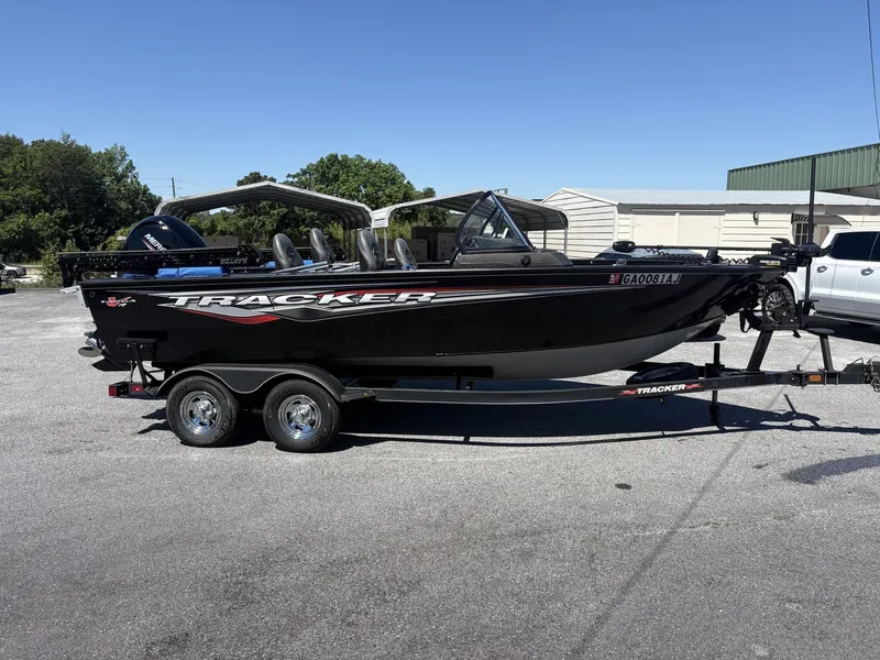 Slide: The Image of 2022 Tracker Targa V19 boat parked on trailer outdoors. - 11