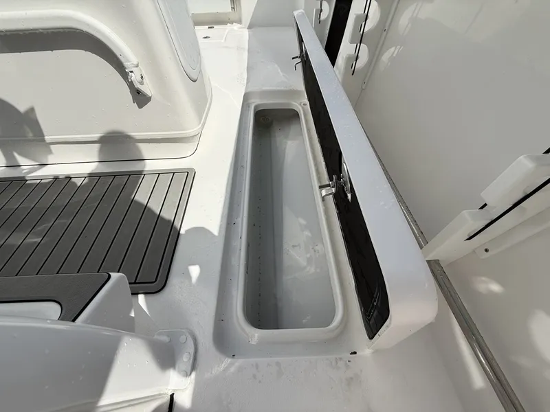 Slide: The Image of Tidewater 272 CC Adventure 2026 with open storage compartment on deck. - 12