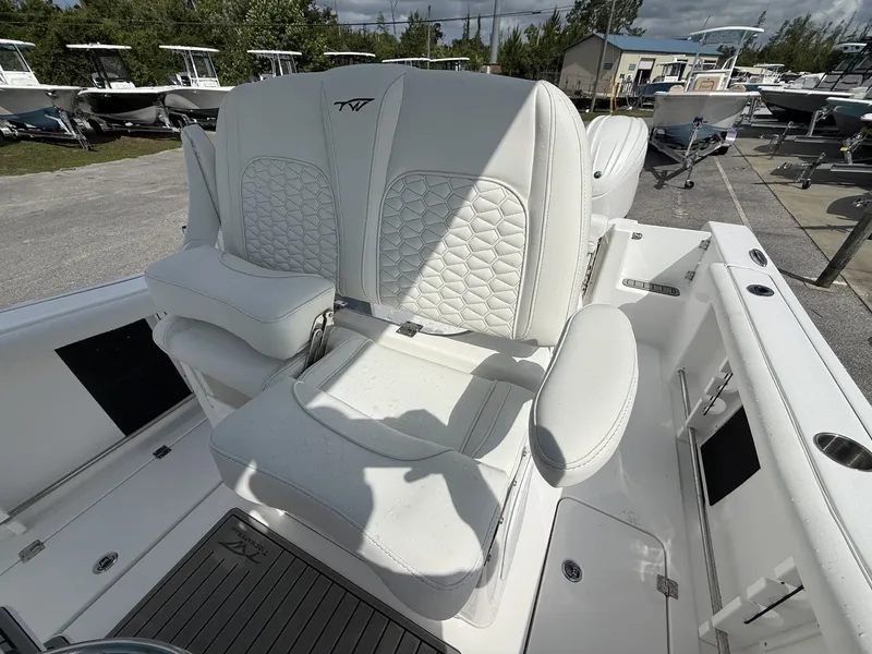 Slide: The Image of 2026 Tidewater 272 CC Adventure boat with luxurious white seating. - 13