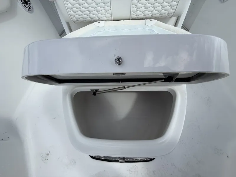 Slide: The Image of Tidewater 272 CC Adventure storage compartment with open lid, 2026 model. - 7