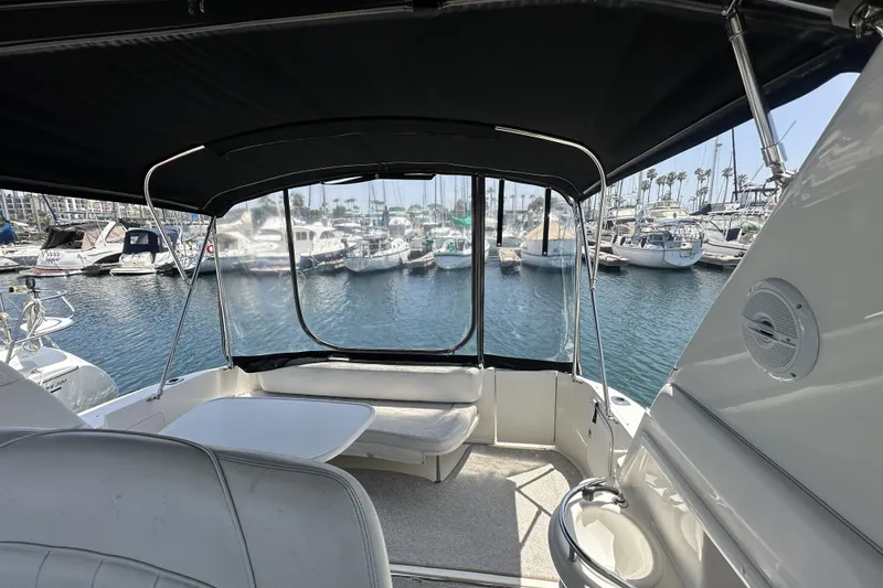 Slide: The Image of 2001 Sea Ray Sundancer 310 interior view with marina backdrop. - 2