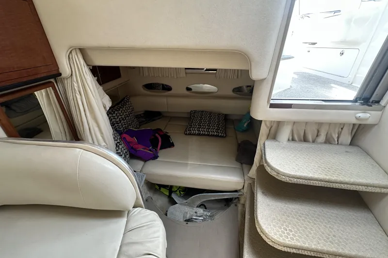 Slide: The Image of Interior cabin of 2001 Sea Ray Sundancer 310 with seating and cushions. - 7