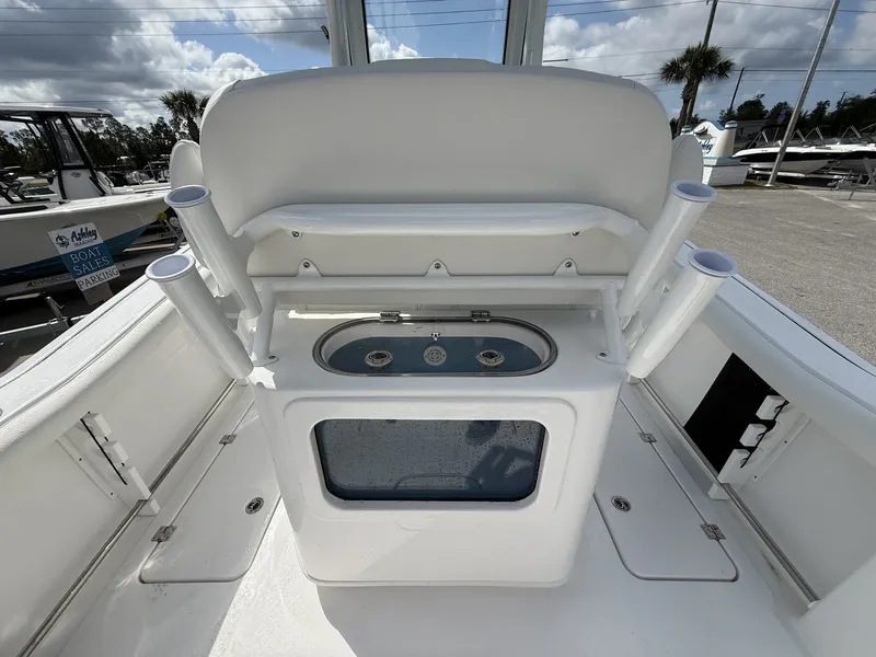 Slide: The Image of 2026 Tidewater 272 CC Adventure with rod holders and storage compartment. - 19