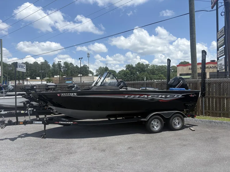 The Image of 2022 Tracker Targa V19 boat on trailer outdoors. - 1