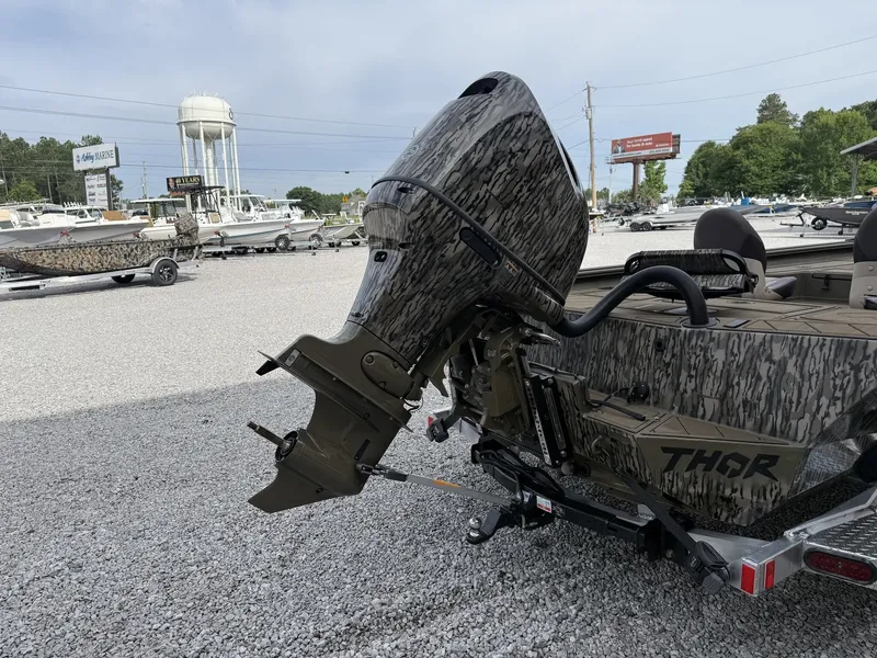 Slide: The Image of Thor Lake Hammer 1900 SC 140HP boat, 2026 model, on gravel lot. - 3