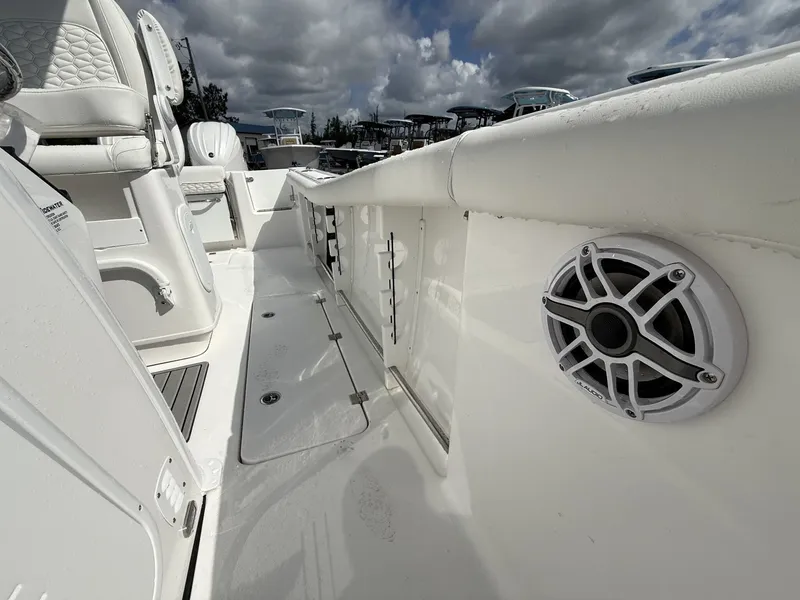 Slide: The Image of Interior view of Tidewater 272 CC Adventure boat, featuring speaker and seating. - 6