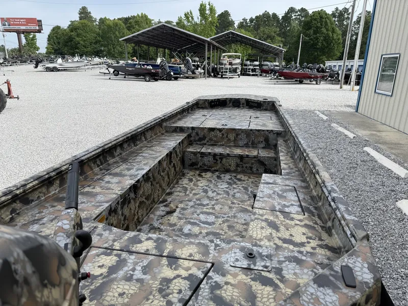 Slide: The Image of 2026 Thor Fish Hammer boat with camouflage pattern on gravel lot. - 5