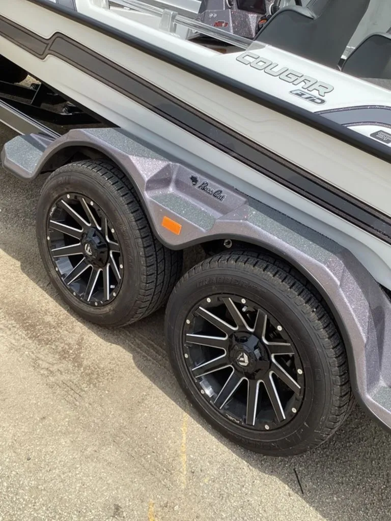 Slide: The Image of 2026 Bass Cat Cougar FTD boat trailer with stylish black rims. - 12